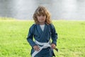 Kid boy practicing martial arts. Sport karate kids. Little boy in kimono doing karate in park. Child training martial Royalty Free Stock Photo