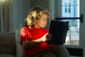 Kid boy reading book at living room. Smart, clever child. Intelligent kid boy read book.