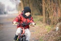 Kid boy riding bicycle in the park