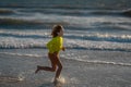 Kid boy running on beach having fun on summer holidays. Happy kids playing on sea. Children in nature with sea. Happy Royalty Free Stock Photo