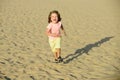 Kid boy running on sand beach vacation. Royalty Free Stock Photo