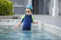 kid boy swimming pool exercise in holiday activities. swim practice sports Royalty Free Stock Photo