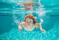 Kid boy swimming underwater on the beach on sea in summer. Blue ocean water. Child boy swimming in sea. Active healthy Royalty Free Stock Photo