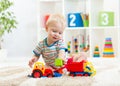 Kid boy toddler playing with toy car Royalty Free Stock Photo