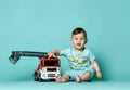 Kid boy toddler playing with toy car indoors Royalty Free Stock Photo