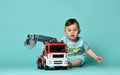 Kid boy toddler playing with toy car indoors Royalty Free Stock Photo