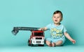 Kid boy toddler playing with toy car indoors Royalty Free Stock Photo