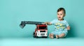 Kid boy toddler playing with toy car indoors Royalty Free Stock Photo