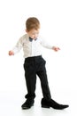 Kid boy trying on father shoes Royalty Free Stock Photo