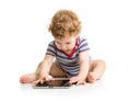 Kid boy using tablet while sitting on the floor Royalty Free Stock Photo