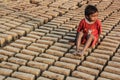 Kid at brick manufacturing site.