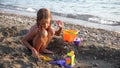 Kid Building Castle on Beach at Sunset, Child Playing Sands, Girl on Seaside, Ocean View Royalty Free Stock Photo