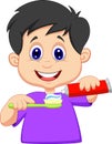 Kid cartoon squeezing tooth paste on a toothbrush Royalty Free Stock Photo