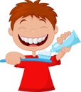 Kid cartoon squeezing tooth paste on a toothbrush Royalty Free Stock Photo