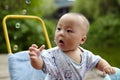 Kid catching soap bubbles Royalty Free Stock Photo