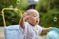 Kid catching soap bubbles Royalty Free Stock Photo