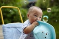 Kid catching soap bubbles Royalty Free Stock Photo