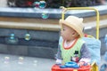 Kid catching soap bubbles Royalty Free Stock Photo