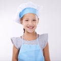 Kid, chef and portrait with apron, confident and child development on white background. Culinary skills, happy and ready