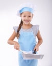 Kid, chef and portrait with pan, confident and child development on white background. Culinary skills, happy and