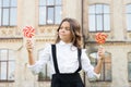 Kid child holding lollipops candy outdoors. Happy kid with candy. School nutrition. Calories and energy. Picking flavour