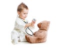 Kid or child playing doctor with stethoscope Royalty Free Stock Photo