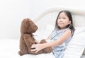 Kid or child playing doctor with stethoscope and teddy bear Royalty Free Stock Photo