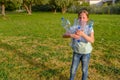 Kid cleaning in park.Volunteer teenager girl cleaning up litter. Royalty Free Stock Photo