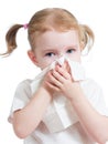 Kid cleaning running nose with tissue isolated