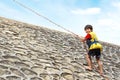 Kid climbing using rope Royalty Free Stock Photo