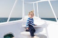 Kid concept. Little kid travel on ship. Kid enjoy sea travelling. Kid on board. Summer vacation and wanderlust