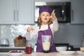 Kid cooking. Chef child cook baking on the kitchen. Royalty Free Stock Photo