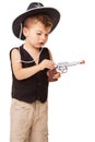 Kid, cowboy hat and revolver gun in studio isolated on a white background mockup space. Child, toy pistol and play in Royalty Free Stock Photo