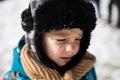 Kid crying after being hit in the face with a snowball