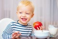 Kid cute boy sit at table with plate and food. Healthy food. Boy cute baby eating breakfast. Baby nutrition. Eat healthy Royalty Free Stock Photo