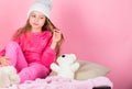 Kid cute girl play with soft toy teddy bear pink background. Unique attachments to stuffed animals. Child small girl Royalty Free Stock Photo