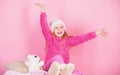 Kid cute girl play with soft toy teddy bear pink background. Unique attachments to stuffed animals. Teddy bears improve Royalty Free Stock Photo