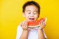 Kid cute little boy attractive laugh smile playing holds cut watermelon fresh for eating