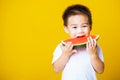 Kid cute little boy attractive laugh smile playing holds cut watermelon fresh for eating