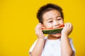 Kid cute little boy attractive laugh smile playing holds cut watermelon fresh for eating