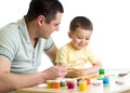 Kid and dad paint together isolated on white Royalty Free Stock Photo