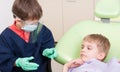 Kid dentist doctor and child patient Royalty Free Stock Photo