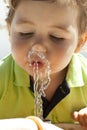 Kid dinking water Royalty Free Stock Photo