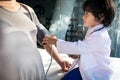 The kid doctor evaluates the patient with a stethoscope, blood pressure monitor