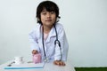 Kid doctor and Medical equipment with pink piggy bank, Saving money for future plan and Health insurance concept