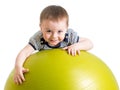 Kid doing fitness exercise on fitness ball Royalty Free Stock Photo