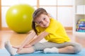 Kid doing fitness exercises Royalty Free Stock Photo