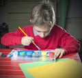 Kid doing homework painting, early educationÃ¢â¬Â¨ Royalty Free Stock Photo