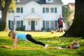 Kid doing push-ups sport exercises in park. Sport, healhty lifestyle, training, active leisure outdoor. Kid pushing up Royalty Free Stock Photo