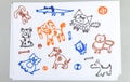 Kid doodle set of cute outline dogs with bones and balls Royalty Free Stock Photo